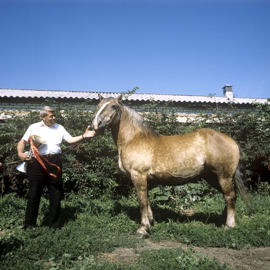 Иван Анцын с конем-чемпионом
