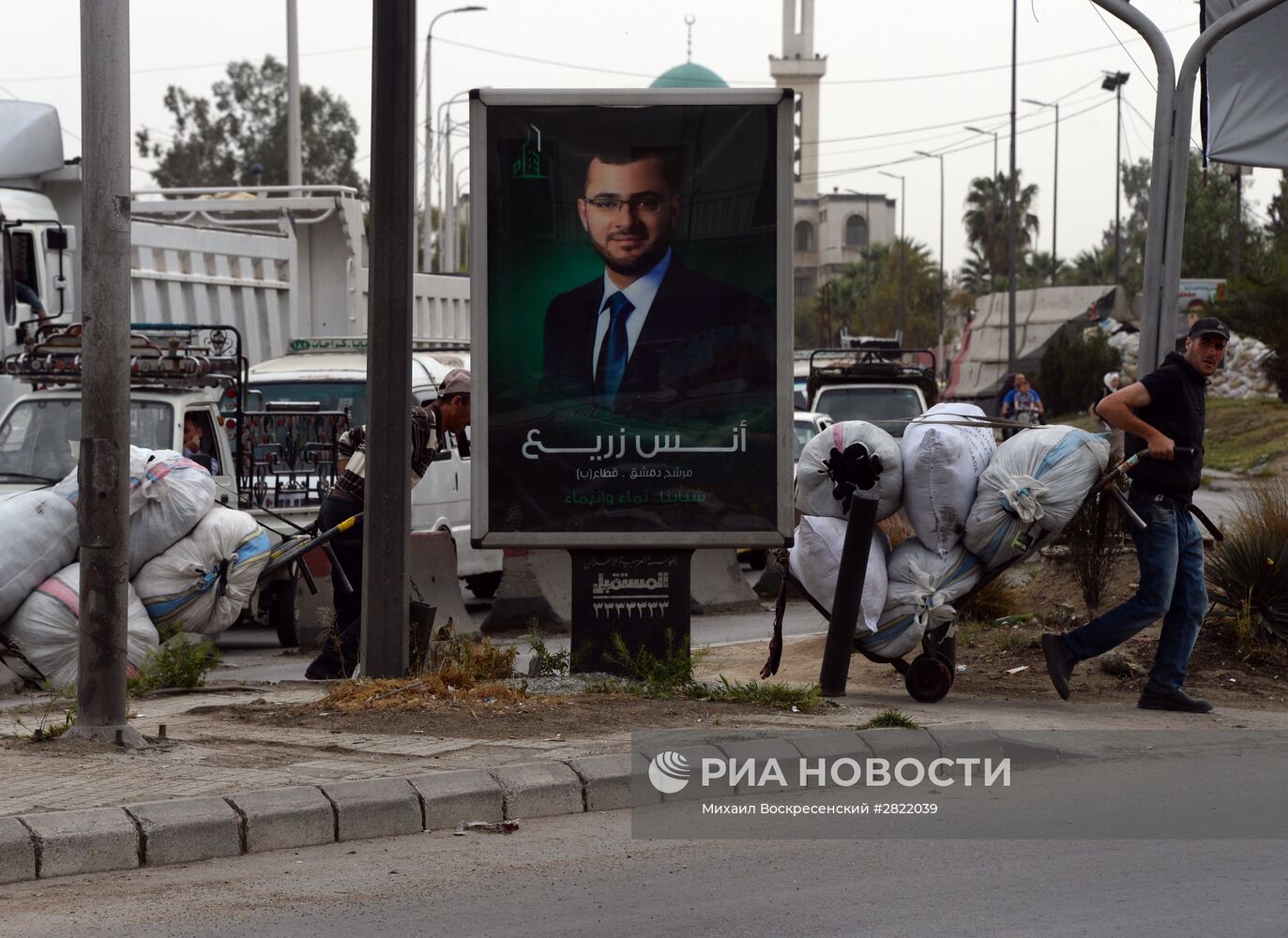 Предвыборные плакаты кандидатов в парламент Сирии