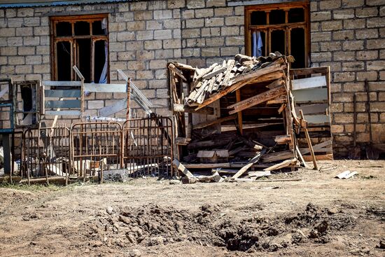 Последствия обстрела на азербайджано-армянской границе