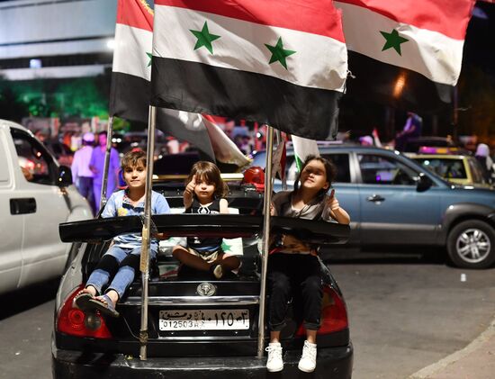 Празднование победы Б. Асада на президентских выборах в Сирии