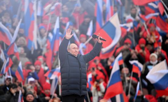 18 марта 2022. Президент РФ Владимир Путин выступает на митинге-концерте в "Лужниках", посвященном воссоединению Крыма с Россией. Место: Россия, Москва. Автор: Рамиль Ситдиков/РИА Новости. НЕДЕЛЯ В ФОТОГРАФИЯХ