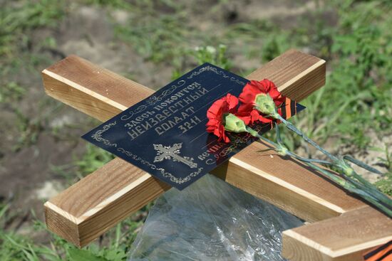 Перезахоронение останков погибших бойцов в ЛНР